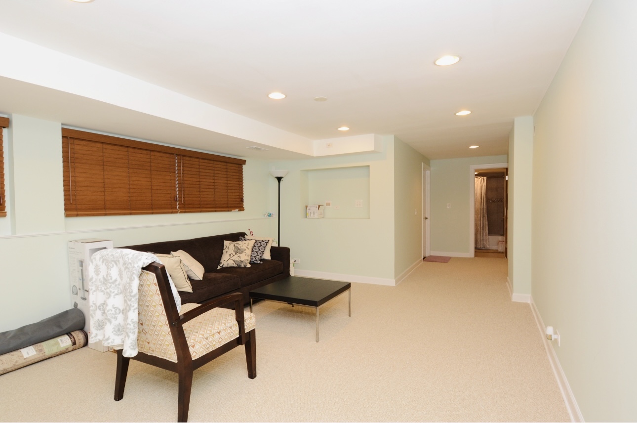 1115 Harms Road Glenview, IL 60025 - Photo 24 of 34 a living room with furniture and a window