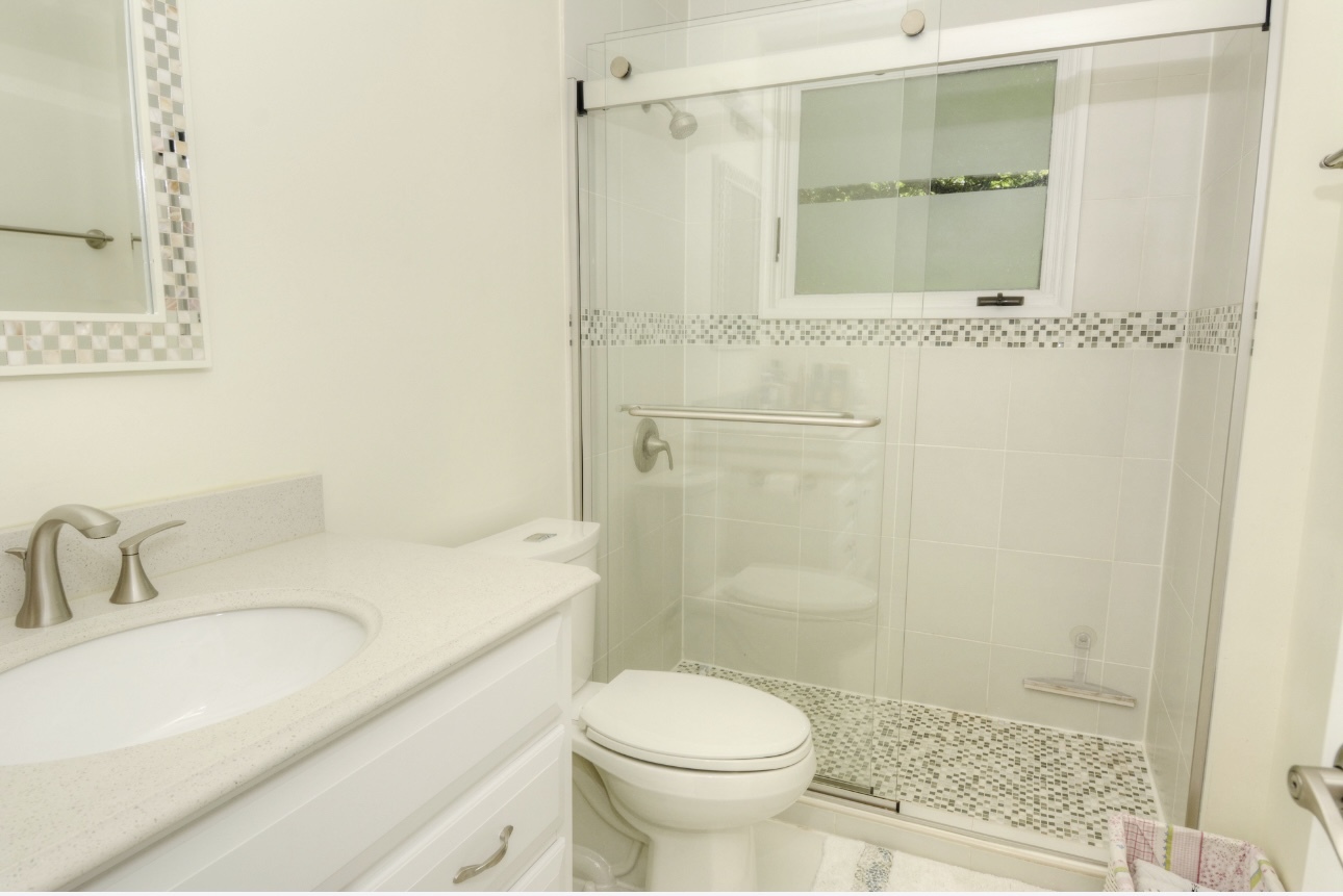 1115 Harms Road Glenview, IL 60025 - Photo 25 of 34 a bathroom with a sink and a mirror