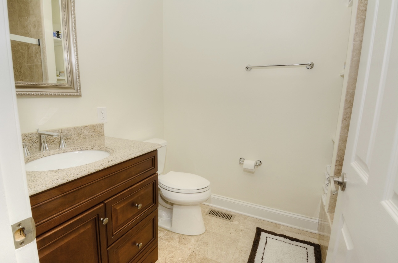 1115 Harms Road Glenview, IL 60025 - Photo 26 of 34 a bathroom with a sink and a toilet