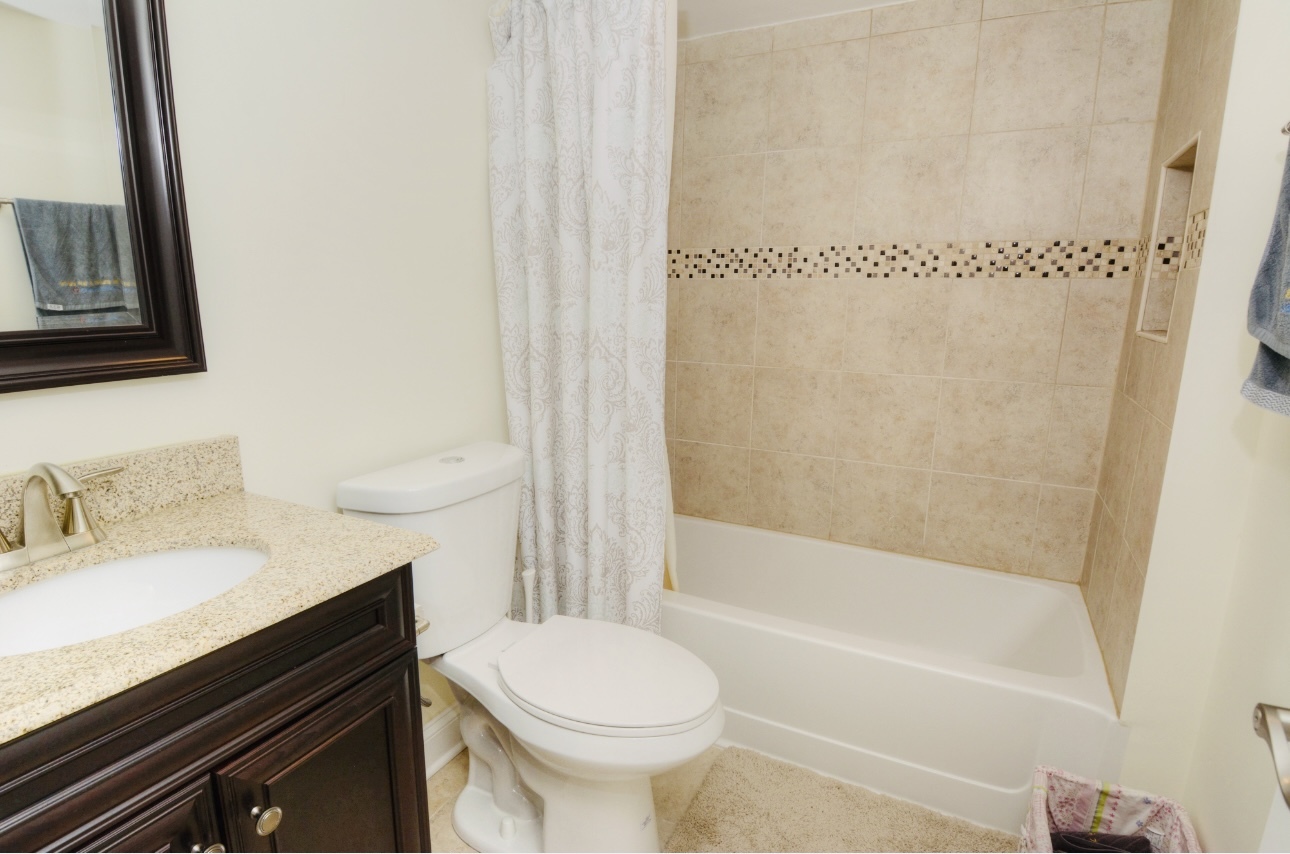 1115 Harms Road Glenview, IL 60025 - Photo 28 of 34 a bathroom with a sink toilet and shower
