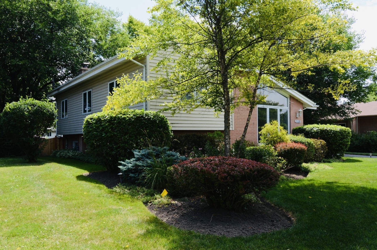 1115 Harms Road Glenview, IL 60025 - Photo 3 of 34 a front view of house with yard and green space