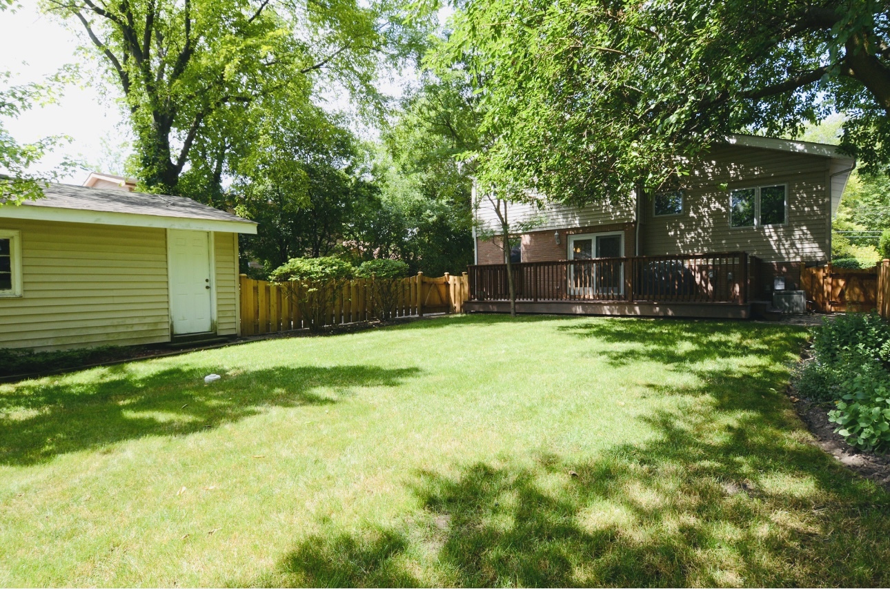 1115 Harms Road Glenview, IL 60025 - Photo 32 of 34 a view of a backyard with a small cabin
