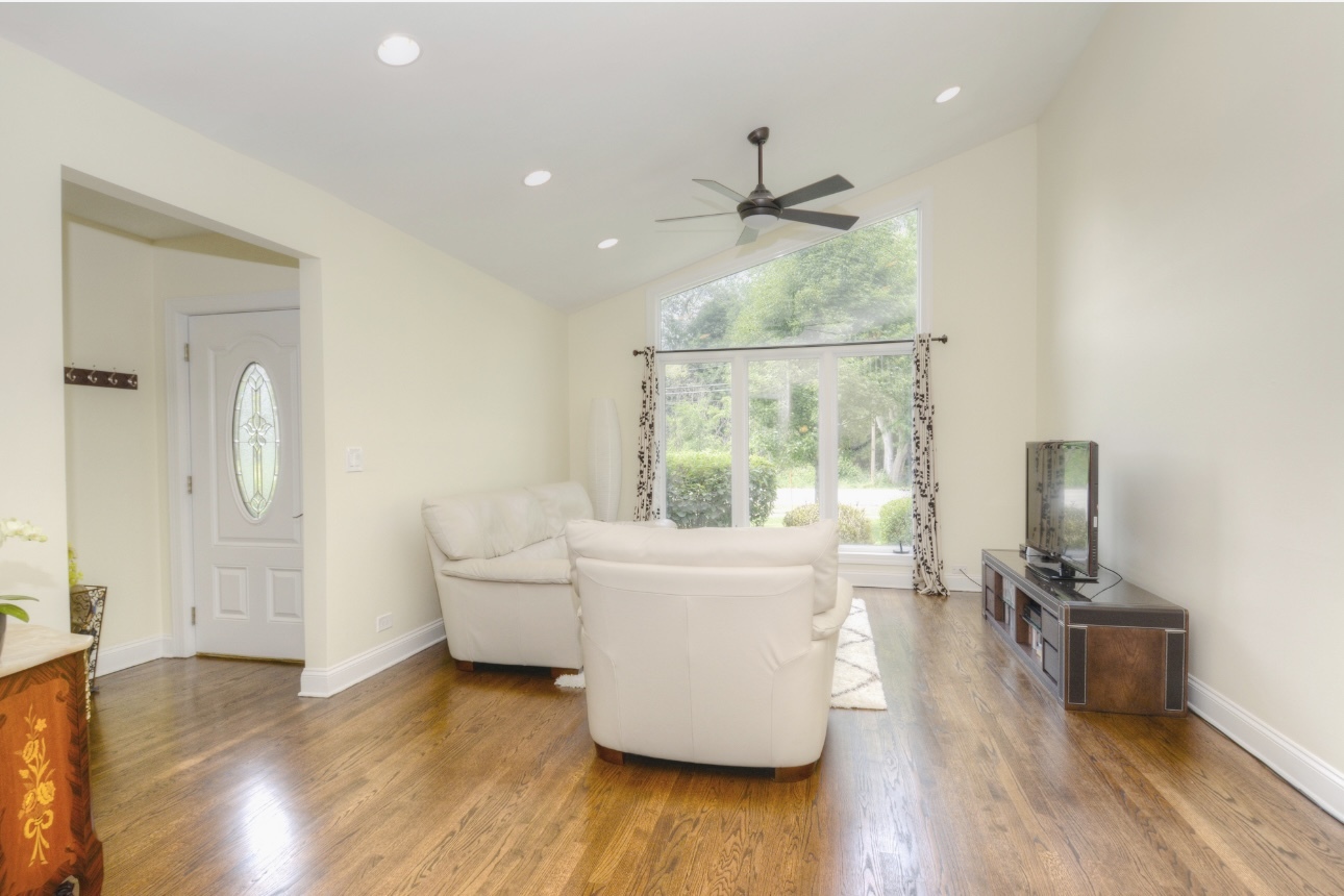 1115 Harms Road Glenview, IL 60025 - Photo 5 of 34 a living room with furniture and a large window