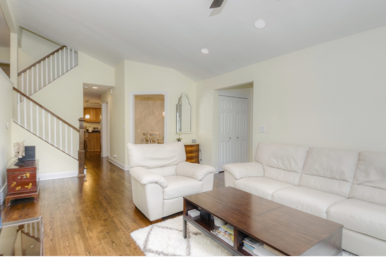 1115 Harms Road Glenview, IL 60025 - Photo 8 of 34 a living room with furniture and a wooden floor