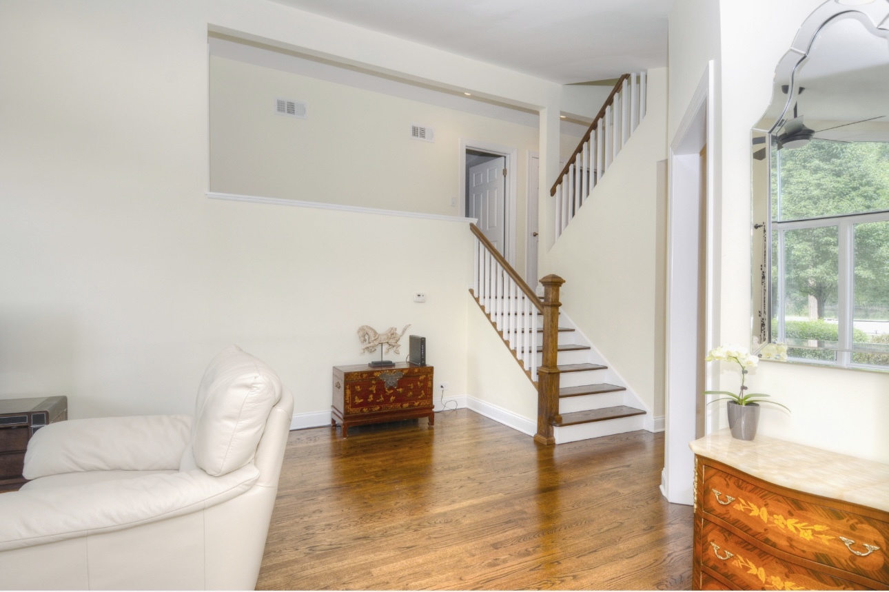 1115 Harms Road Glenview, IL 60025 - Photo 10 of 34 a view of entryway and hall with wooden floor