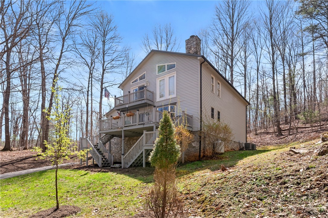 271 Quail Hollow Road Crumpler, NC 28617 - Photo 2 of 30 a front view of a house with garden