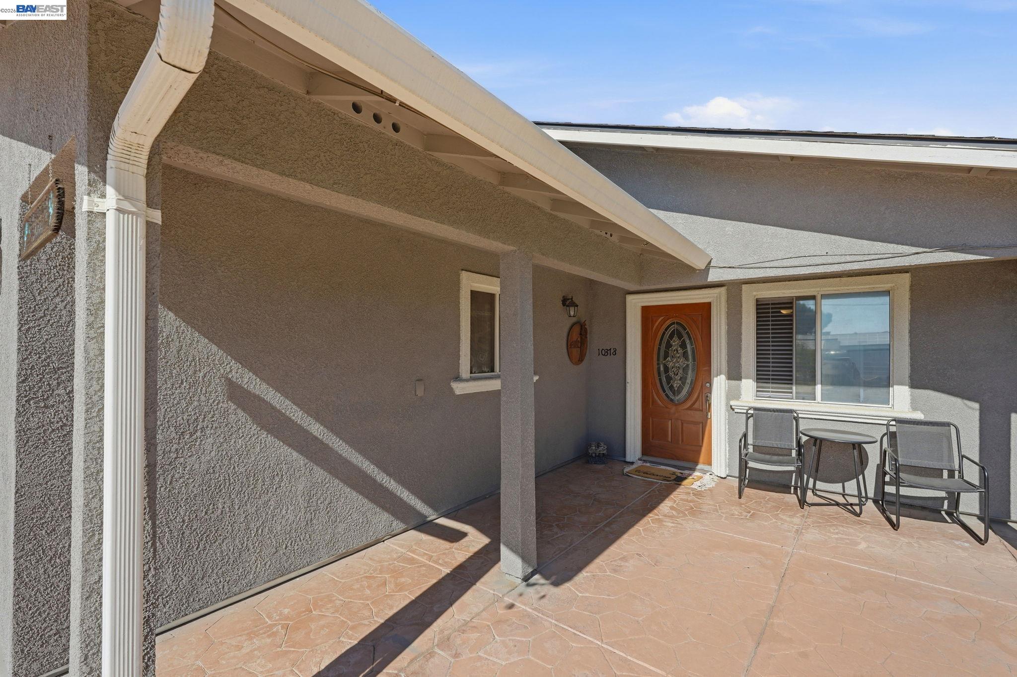 10378 South Priest Road French Camp, CA 95231 - Photo 4 of 44 a balcony with table and chairs and potted plants