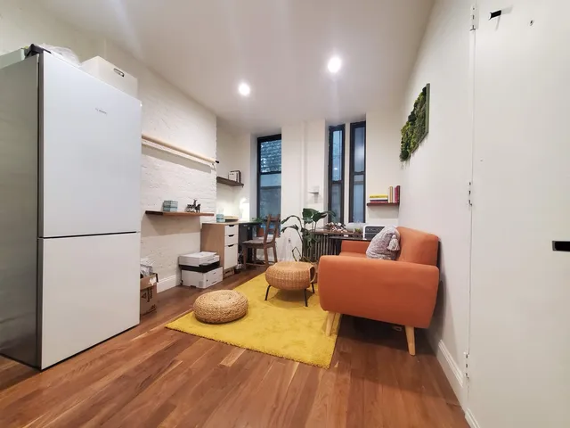 front view of a building with a garden