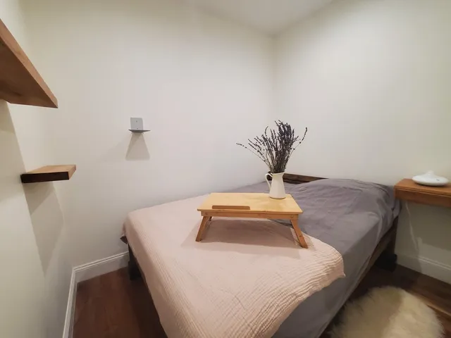 a kitchen with kitchen island a wooden floor and chairs