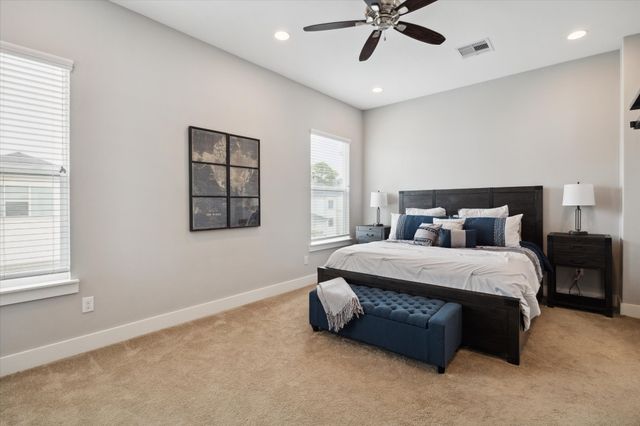 a bedroom with a bed and window