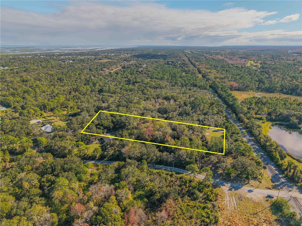 480 Clinton Cemetery Road Edgewater, FL 32141 - Photo 13 of 29 a view of a yard with a lake view