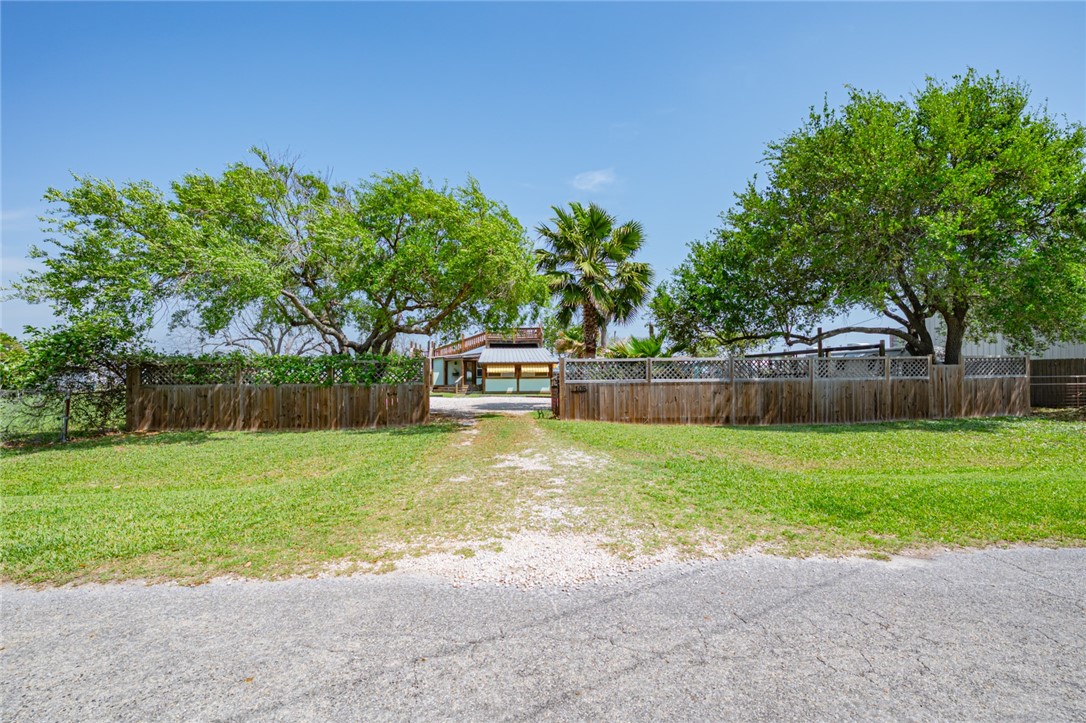 108 North 2nd Street Fulton, TX 78382 - Photo 2 of 23 a view of a yard with a house in the background