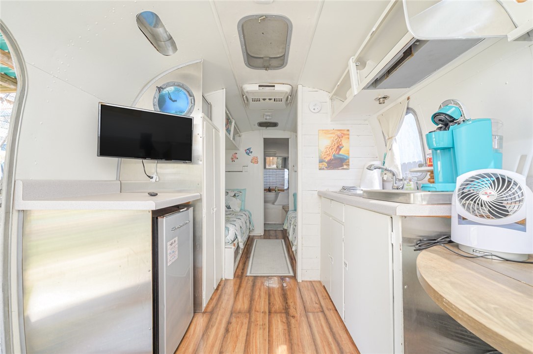 108 North 2nd Street Fulton, TX 78382 - Photo 21 of 23 a floor to ceiling window with a flat screen tv