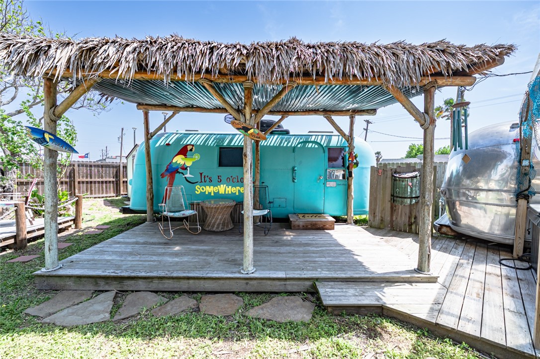 108 North 2nd Street Fulton, TX 78382 - Photo 5 of 23 a backyard of a house with barbeque oven table and chairs