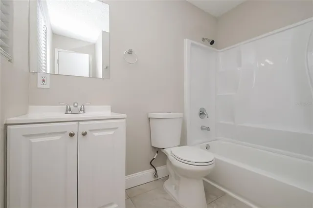 a bathroom with a toilet sink and shower
