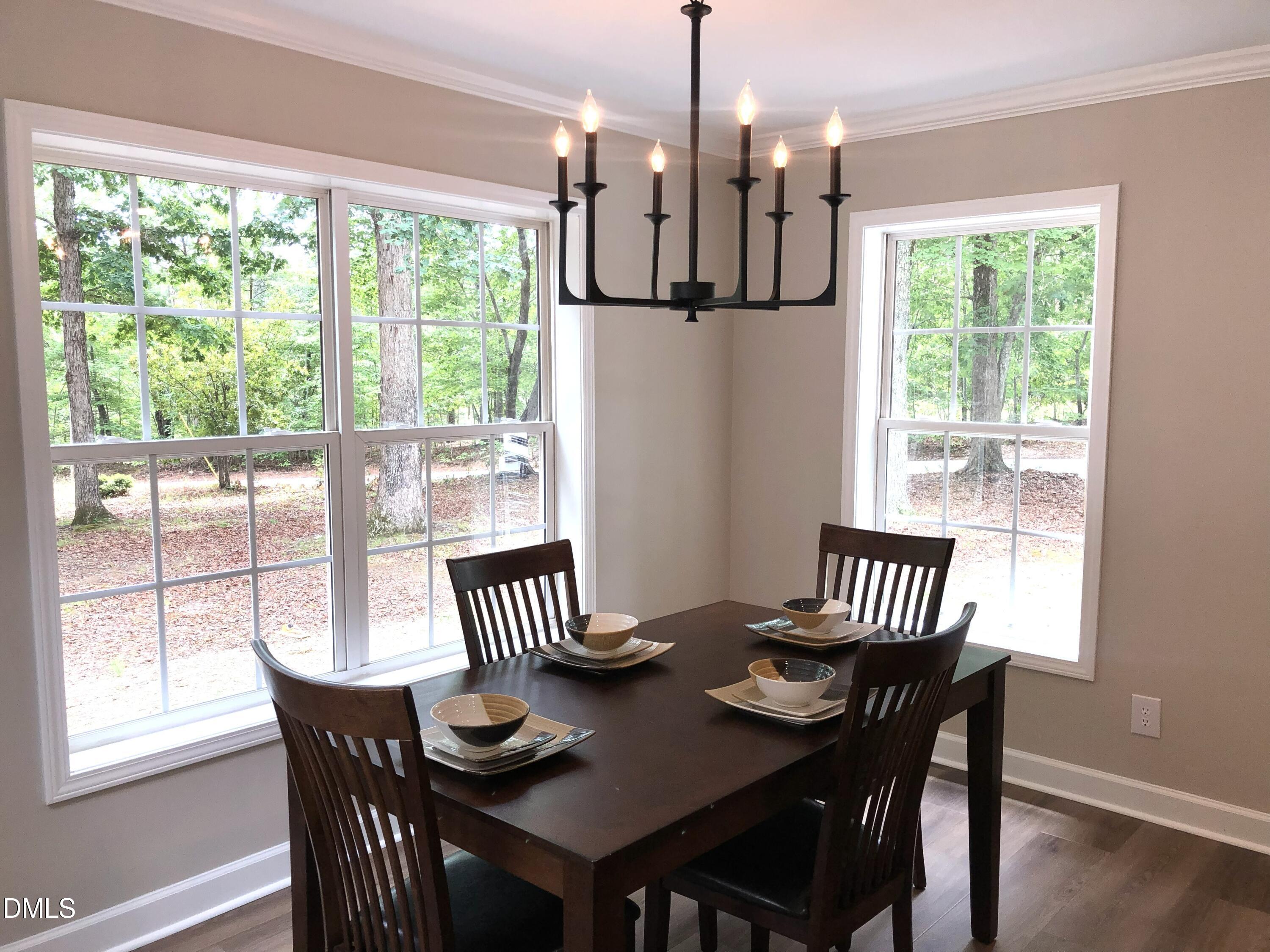 95 Smith Taylor Trail Roxboro, NC 27574 - Photo 7 of 47 a view of a dining room with furniture window and outside view