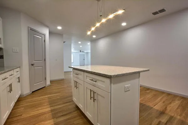 a bathroom with a sink a mirror and a shower