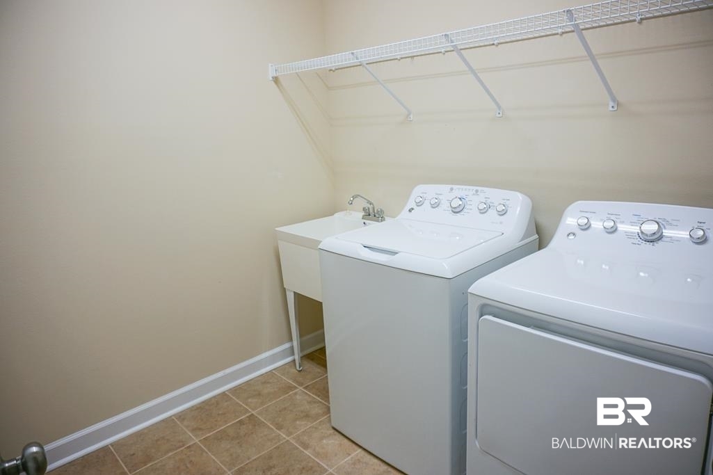 593 Begeman Road Mobile, AL 36608 - Photo 16 of 23 Laundry room featuring washer and dryer and tile floors