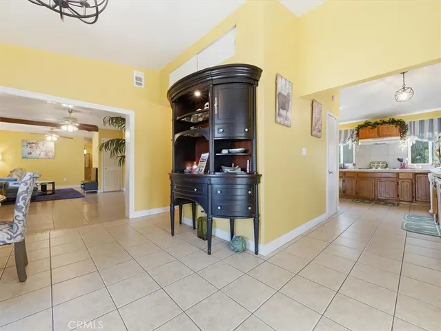 a lobby with furniture and rug