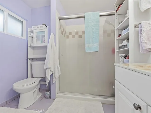 a bathroom with a toilet sink and shower