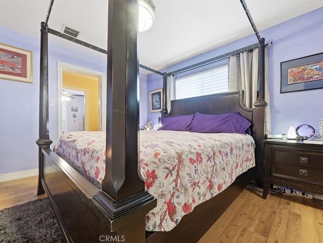 a bedroom with bed and window