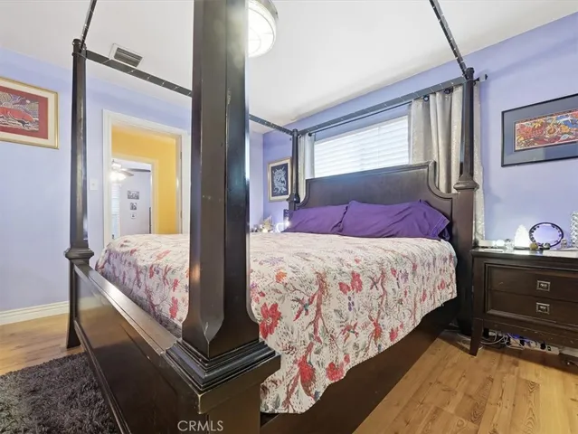 a bedroom with bed and window