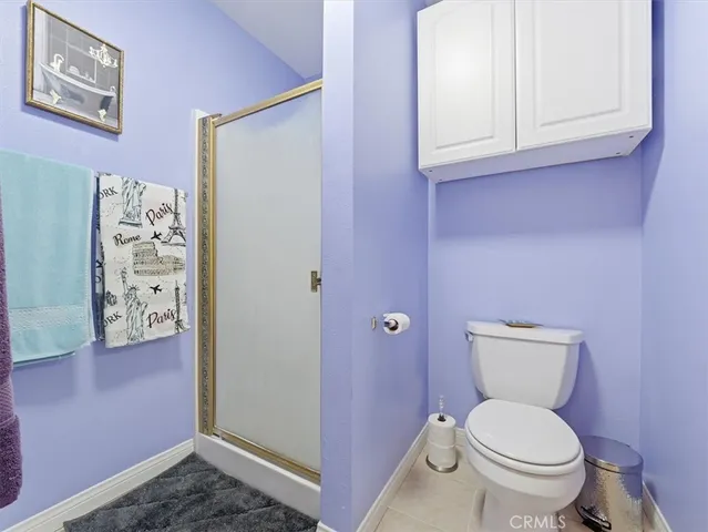 a bathroom with a sink mirror vanity and toilet
