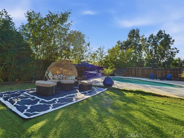 a view of balcony with two chairs and wooden floor