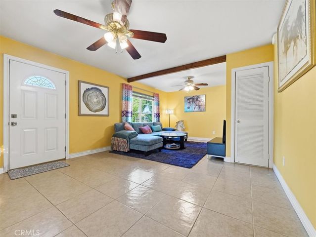 a living room with furniture and a window