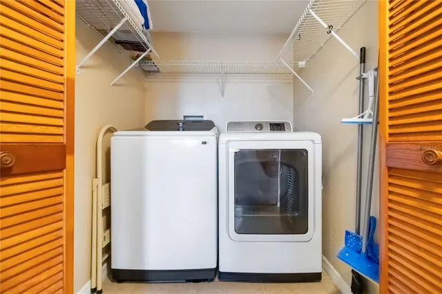 a utility room with dryer and washer