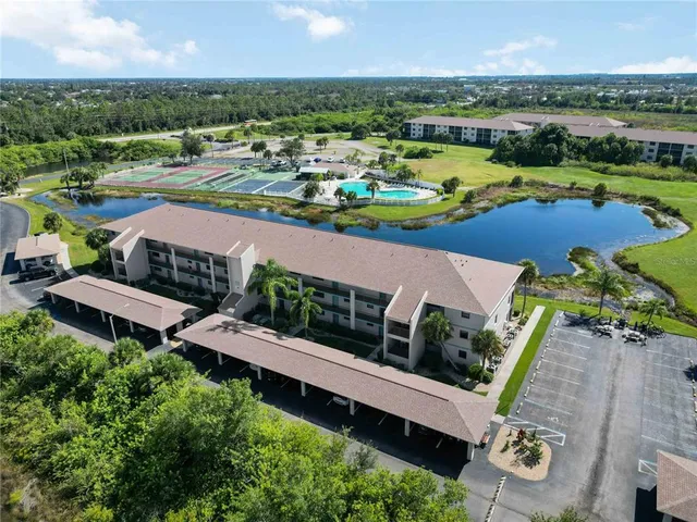 an aerial view of a house with garden space and houses