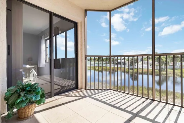 a balcony with view of outdoor space