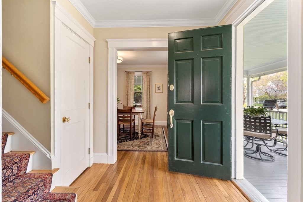 4 Ward Street Lexington, MA 02421 - Photo 3 of 17 a view of a hallway with wooden floor and dining room