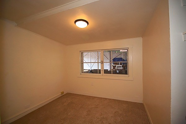17-1048 Volcano Road Mountain View, HI 96771 - Photo 6 of 24 an empty room with windows