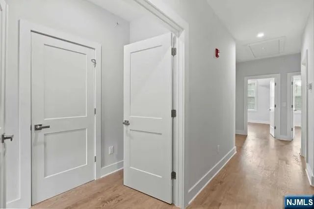 a bathroom with a granite countertop toilet sink and mirror