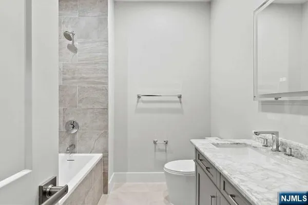 a view of a bathroom with mirror