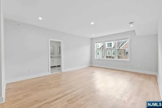 a bathroom with a granite countertop sink a toilet and bathtub