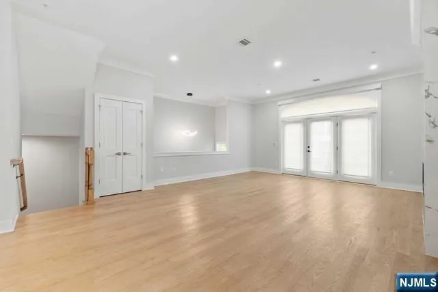 a view of a big room with furniture and a projector