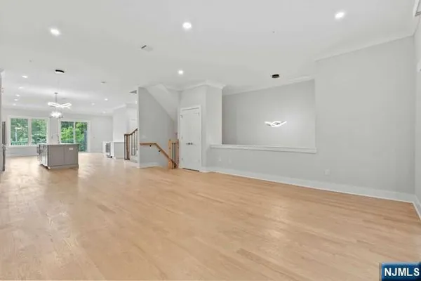 a kitchen with kitchen island a sink stainless steel appliances and cabinets
