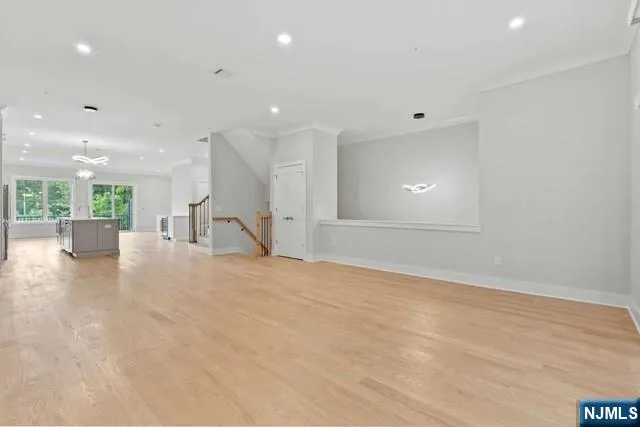 a kitchen with kitchen island a sink stainless steel appliances and cabinets