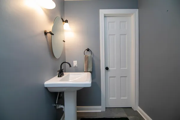 a bathroom with a sink a mirror and shower