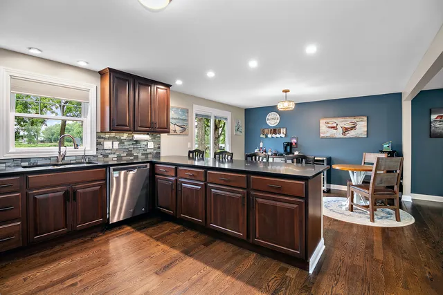 a bathroom with a sink a mirror and shower