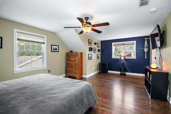 a bedroom with furniture and window