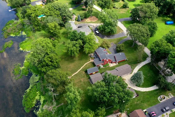 an aerial view of a house with a yard