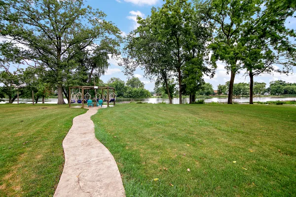 a view of a porch with furniture and yard