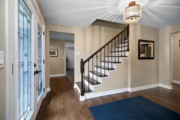 a view of entryway with wooden floor