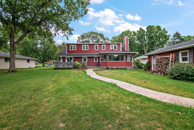 a view of a street with a yard