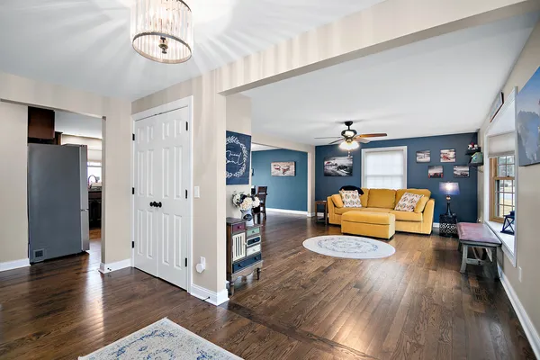 a bedroom with furniture and wooden floor