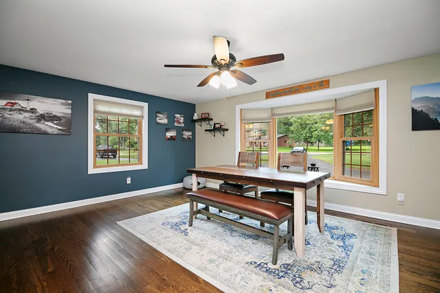 a living room with a table and a window