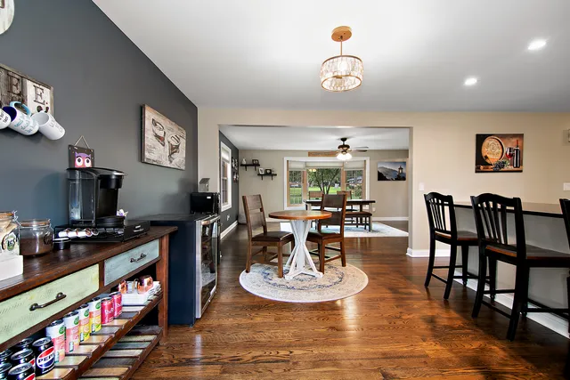 a living room with furniture a rug and a flat screen tv